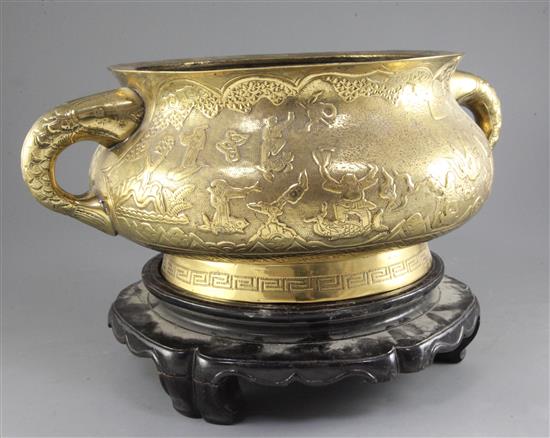 A very large Chinese bronze two handled censer, Gui, early 20th century, width 43.5cm diameter 32cm, wood stand, total weight 13.56kg